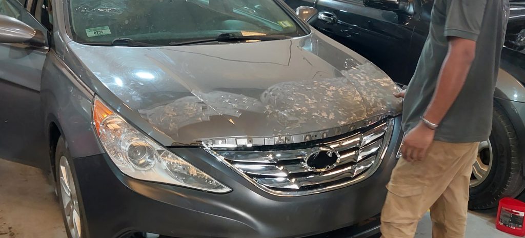 Expert car bonnet repair service in Abu Dhabi – dent removal and repainting at Desert Auto Expert, Mussafah.